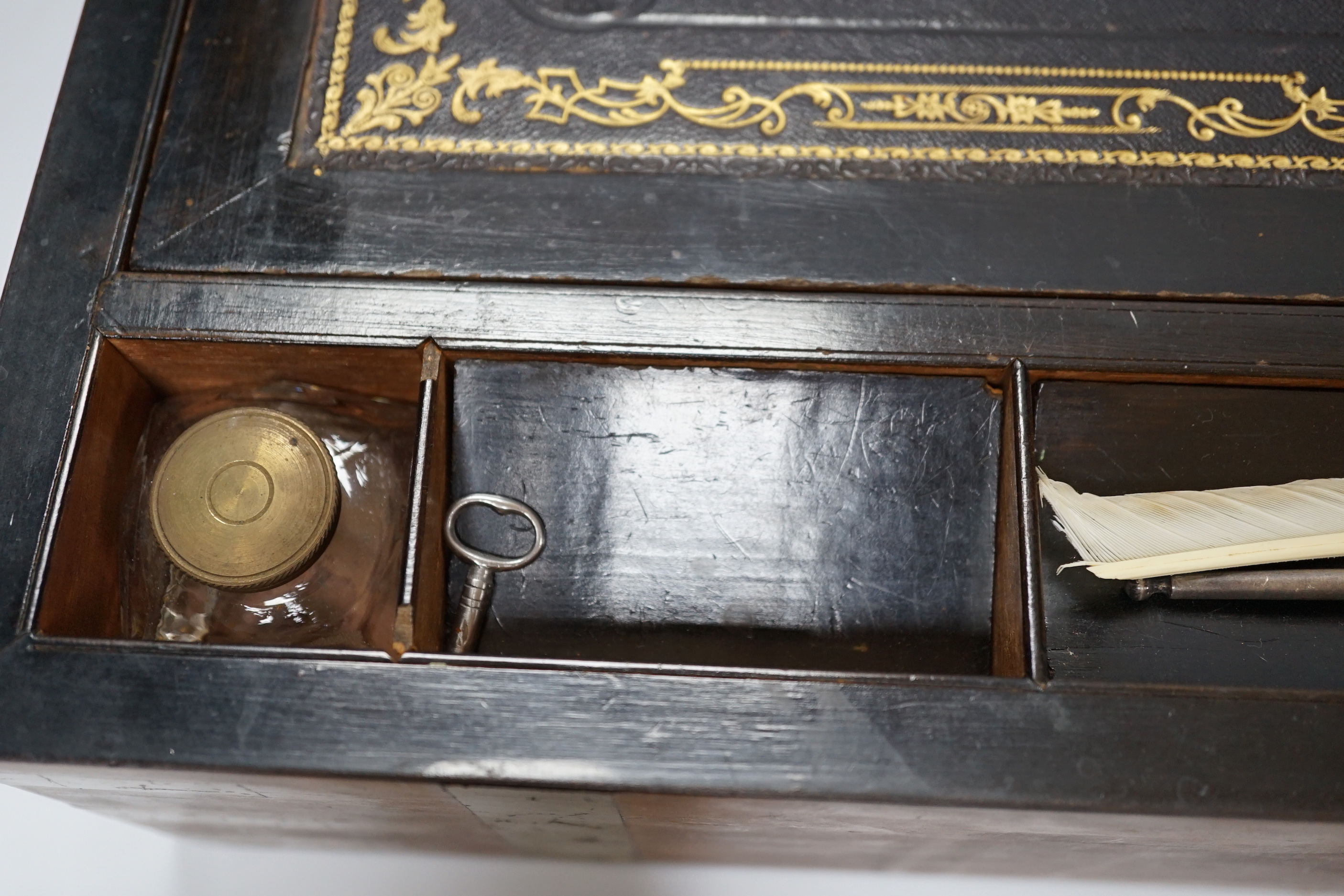 A Victorian walnut brass bound writing slope, 50cm wide x 25cm deep x 18cm high